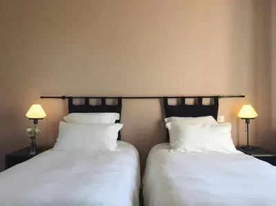 Un ou plusieurs lits dans un hébergement de l'établissement Maison Gabriel - Jacuzzi
