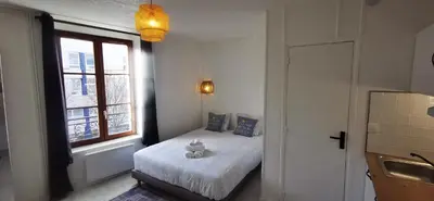 Un ou plusieurs lits dans un hébergement de l'établissement Le 288 - Appartements Reimois
