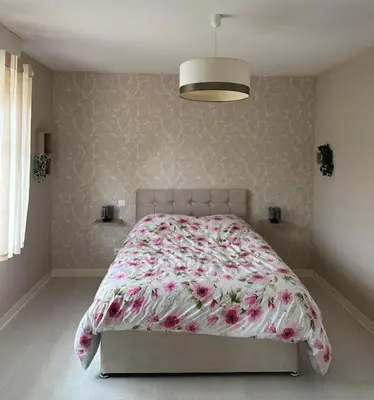 Un ou plusieurs lits dans un hébergement de l'établissement Charmante maison comme chez soi