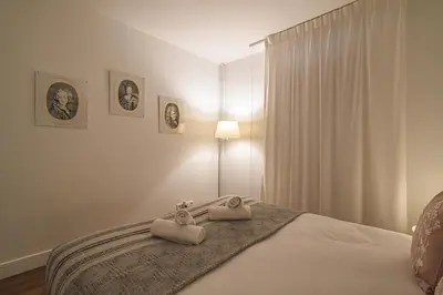 Un ou plusieurs lits dans un hébergement de l'établissement Le Tambour Appartement Lumineux au Centre de Reims
