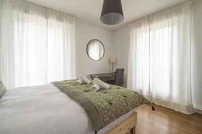 Un ou plusieurs lits dans un hébergement de l'établissement Le Tambour Appartement Lumineux au Centre de Reims