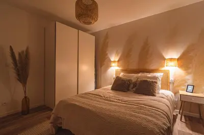 Un ou plusieurs lits dans un hébergement de l'établissement La Maison Des Roses
