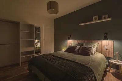 Un ou plusieurs lits dans un hébergement de l'établissement La Maison Des Roses