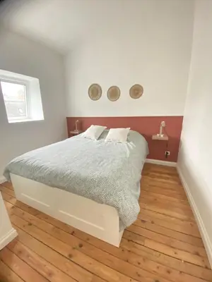 Un ou plusieurs lits dans un hébergement de l'établissement L'atelier- appartement 2 chambres