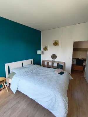Un ou plusieurs lits dans un hébergement de l'établissement Maison 4 chambres proche Reims