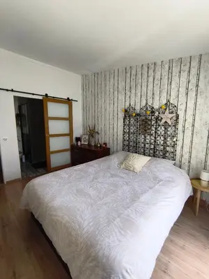 Un ou plusieurs lits dans un hébergement de l'établissement Maison 4 chambres proche Reims