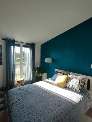Un ou plusieurs lits dans un hébergement de l'établissement Maison 4 chambres proche Reims