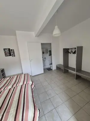 Un ou plusieurs lits dans un hébergement de l'établissement Motel le Bon Samaritain