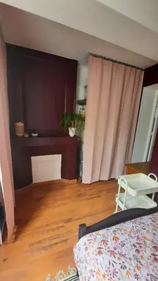 Un ou plusieurs lits dans un hébergement de l'établissement Chambre cosy