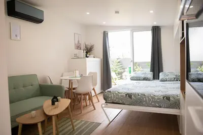 Un ou plusieurs lits dans un hébergement de l'établissement Rez de Jardin - Calme & Familiale
