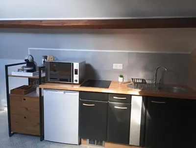Cuisine ou kitchenette dans l'établissement Au 112, maison d'hôtes meublée