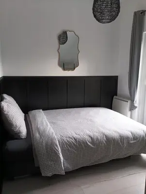 Un ou plusieurs lits dans un hébergement de l'établissement Au 112, maison d'hôtes meublée