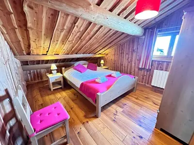 Un ou plusieurs lits dans un hébergement de l'établissement C Les rondins nature gîte 8 personnes avec jardin