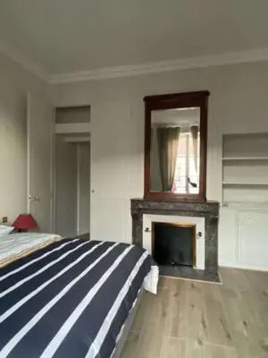 Un ou plusieurs lits dans un hébergement de l'établissement Appartement Brasserie du Jard 2 chambres