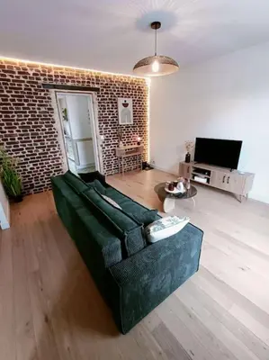 Télévision ou salle de divertissement dans l'établissement Appartement Cosy et accueillant