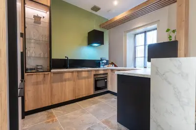 Cuisine ou kitchenette dans l'établissement Le Château de Manon