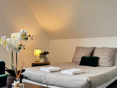 Un ou plusieurs lits dans un hébergement de l'établissement Appartement Platanes 7 - Proche Disneyland - Parking Gratuit - Meaux