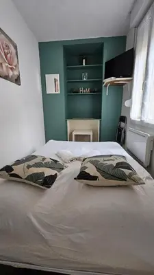 Un ou plusieurs lits dans un hébergement de l'établissement Studio New York hypercentre Reims