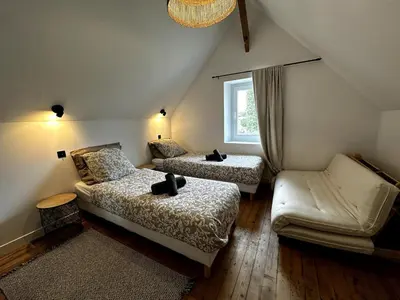 Un ou plusieurs lits dans un hébergement de l'établissement Grande maison de charme avec jardin