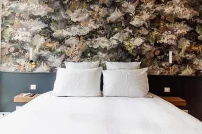Un ou plusieurs lits dans un hébergement de l'établissement La Rêverie - Deluxe Apartment - SPA - Place du Forum