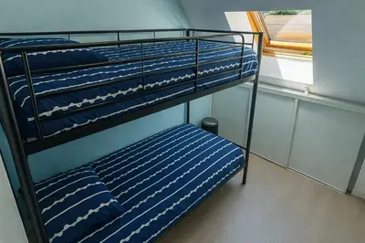 Un ou plusieurs lits dans un hébergement de l'établissement Charmante Maison Wifi télé 65 pouces netflix