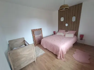 Un ou plusieurs lits dans un hébergement de l'établissement Le chalet du lilas