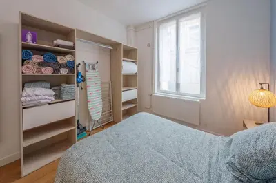 Un ou plusieurs lits dans un hébergement de l'établissement Appartement cosy proche de la gare