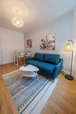Coin salon dans l'établissement Appartement cosy proche de la gare