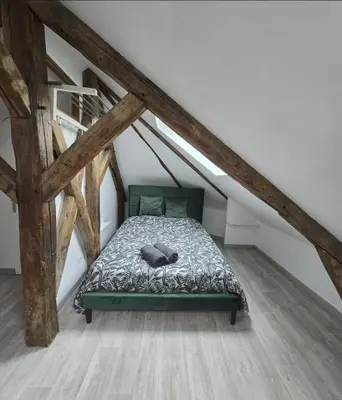 Un ou plusieurs lits dans un hébergement de l'établissement Studio cosy proche centre-ville