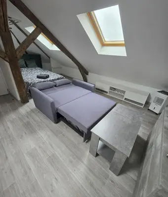 Un ou plusieurs lits dans un hébergement de l'établissement Studio cosy proche centre-ville