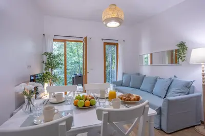 Coin salon dans l'établissement Les Charmes C23B - Le Val Joly