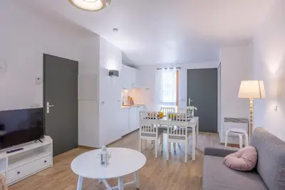 Coin salon dans l'établissement Les Charmes C38 - Le Val Joly
