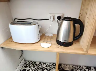 Plateau bouilloire dans l'établissement Le Garden Champ'- Duplex, jardin
