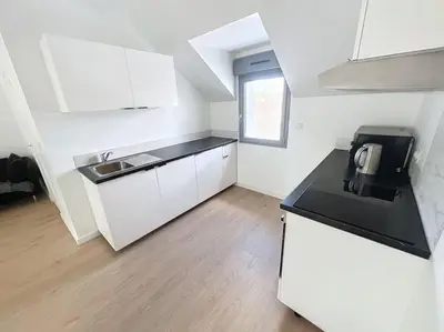 Cuisine ou kitchenette dans l'établissement Appartement neuf proche gare