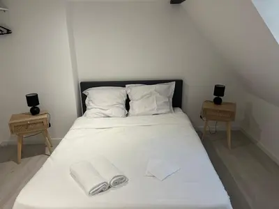 Un ou plusieurs lits dans un hébergement de l'établissement Appartements centre-ville Avesnes sur Helpe Duplex confort
