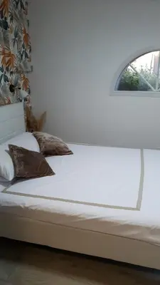 Un ou plusieurs lits dans un hébergement de l'établissement Petit nid cosy