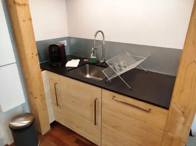 Cuisine ou kitchenette dans l'établissement Le Coq Bleu
