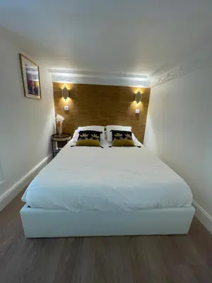 Un ou plusieurs lits dans un hébergement de l'établissement Appartement de charme Art Déco - Hyper-centre ville - Place d'Erlon - Gare - Reims