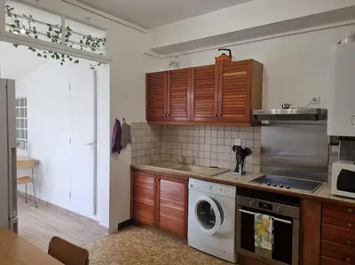 Cuisine ou kitchenette dans l'établissement Maison chaleureuse près Disney