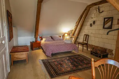 Un ou plusieurs lits dans un hébergement de l'établissement Gîte cosy, champêtre, classé 3 étoiles Le bout du L