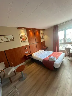 Un ou plusieurs lits dans un hébergement de l'établissement Hôtel Victoria