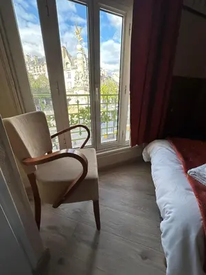 Un ou plusieurs lits dans un hébergement de l'établissement Hôtel Victoria