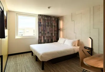 Un ou plusieurs lits dans un hébergement de l'établissement B&B HOTEL Meaux Nanteuil-lès-Meaux 3 étoiles