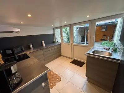 Cuisine ou kitchenette dans l'établissement Maison de ville Chauny