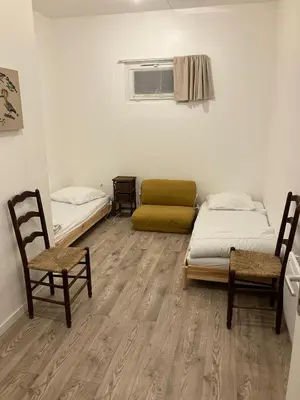 Un ou plusieurs lits dans un hébergement de l'établissement Loft des oiselets
