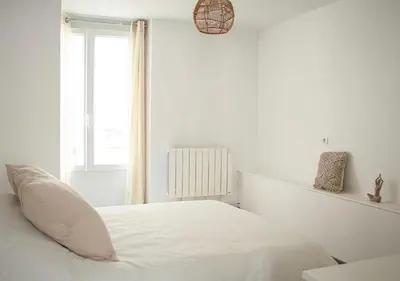 Un ou plusieurs lits dans un hébergement de l'établissement Appartement Cozy - Proximité Maisons de Champagne - Wifi