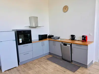 Cuisine ou kitchenette dans l'établissement Appartement Magnum