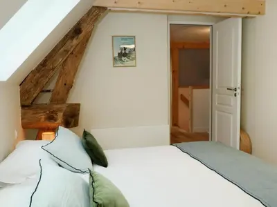 Un ou plusieurs lits dans un hébergement de l'établissement Le Jardin d'Aimee by La boite en Plus