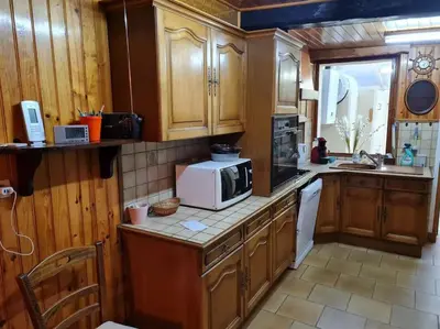Cuisine ou kitchenette dans l'établissement La Petite Maison Pa'Meuse