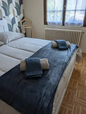Un ou plusieurs lits dans un hébergement de l'établissement Maison Chez Papy Chapeau 4 étoiles